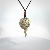 Hand carved deer antler brain with snake pendant. Hand carved by NZ Pacific. Free postage worldwide. Hand made brain with snake head necklace from deer antler. Brain with snake necklace for men and women.
